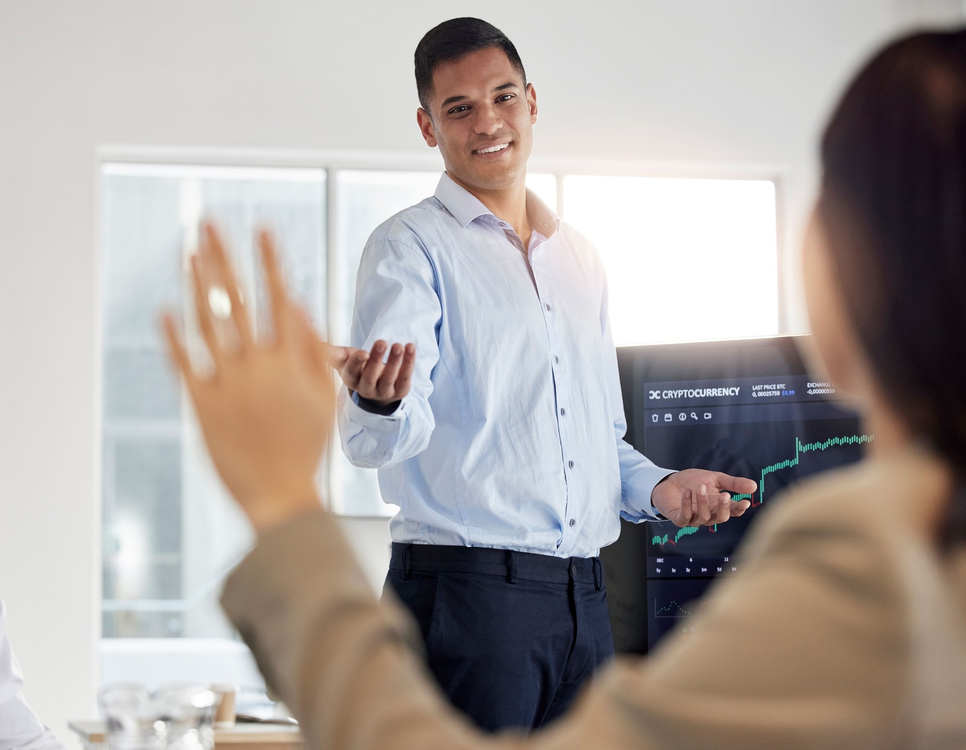 Presentation, stock market and businessman in meeting with question, coaching on trading and finance. Business people, teaching and learn about cryptocurrency and investment data with communication